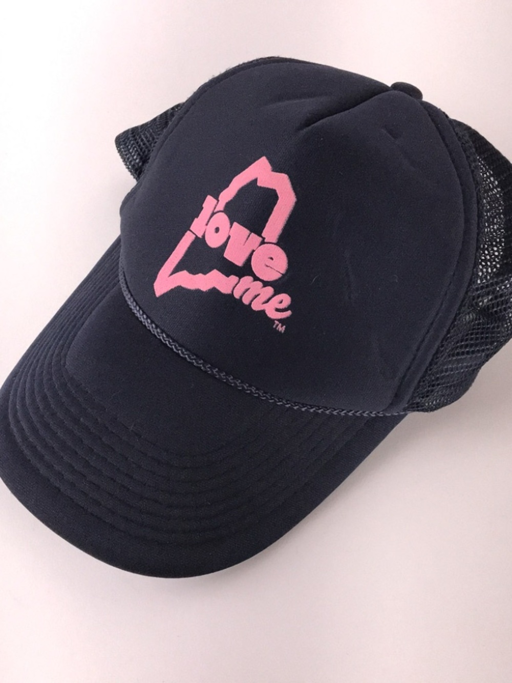 Love ME Maine state outline in pink on blue trucker hat